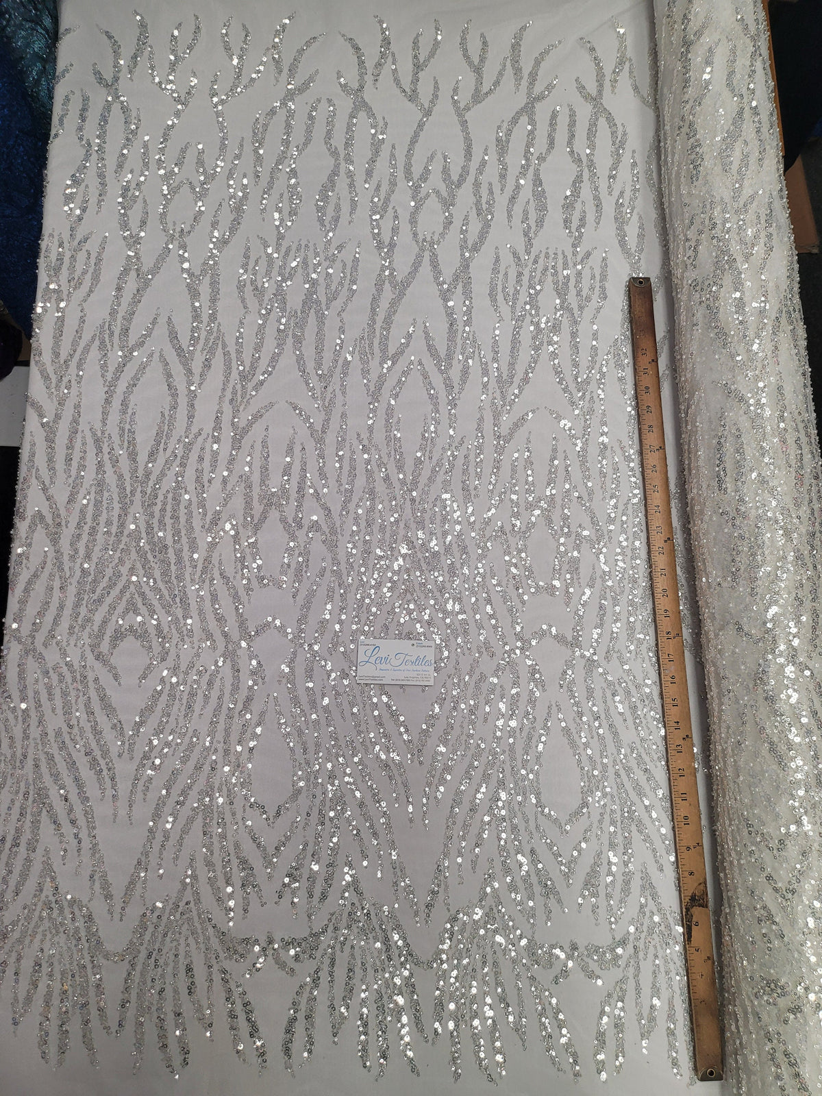 Off-white hand-beaded French lace with embroidered detail
