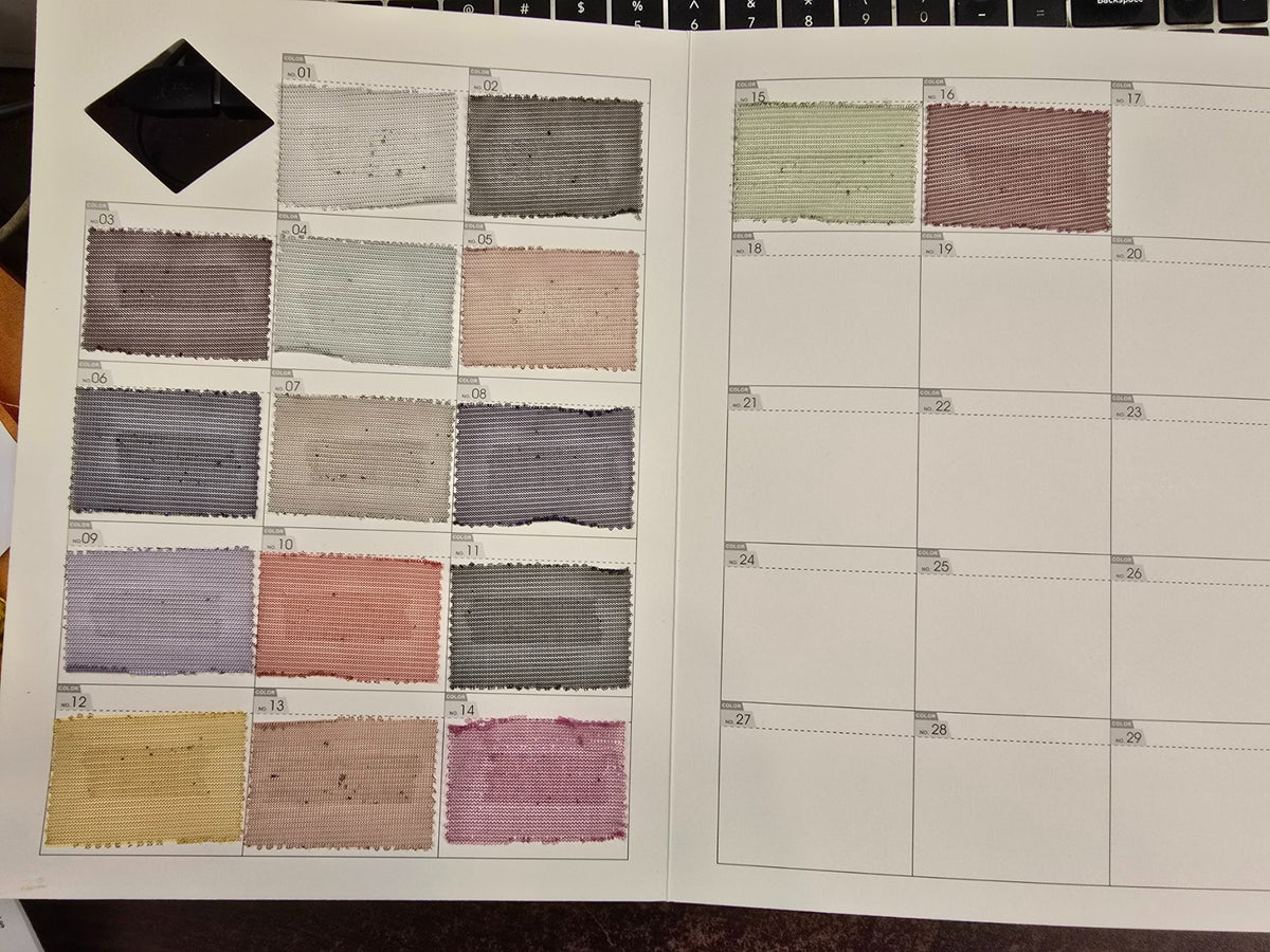 Actual fabric swatches for Mozi Couture #24-112, colors 01–16